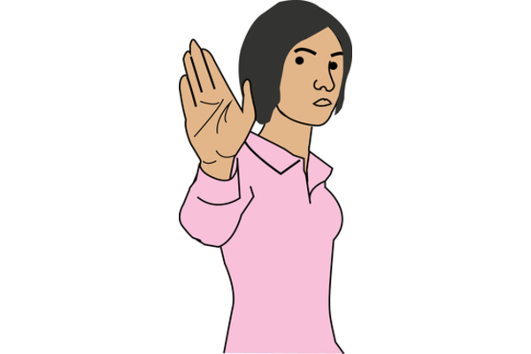 A person holding their hand up, palm forward, to communicate "stop"