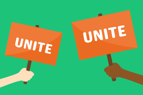 An image of two hands holding placards that both say "unite"