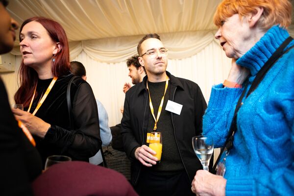 A photo of campaigner David Challen talking to Dame Vera Baird at Respect's 25th anniversary event.