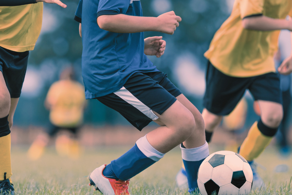 Image of young people playing football