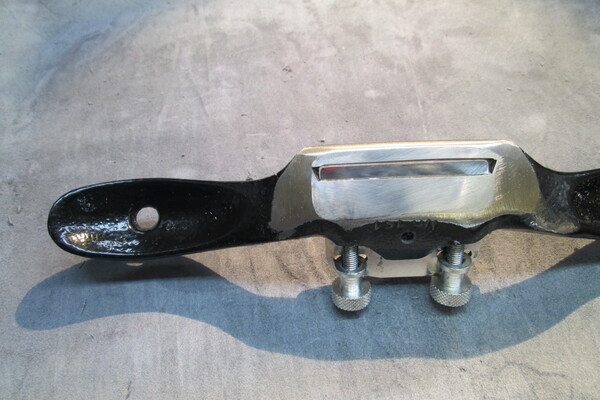 Photo of the bottom of a spokeshave modified for leather paring