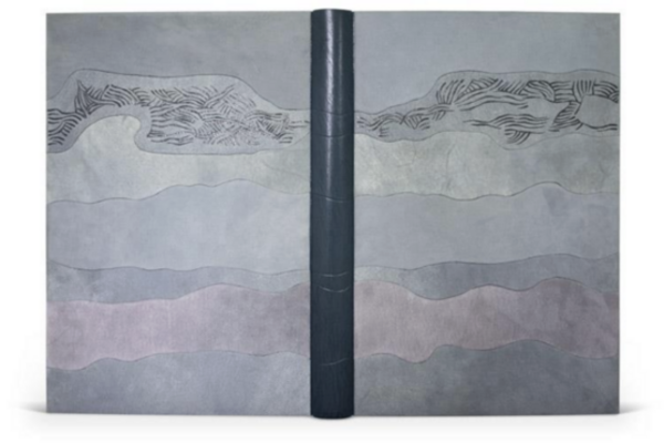 A fine binding of Welsh Landscapes bound by Joanna Bird. The spine is navy leather with the boards covered in paper in varying shades of grey in a cloudlike pattern.