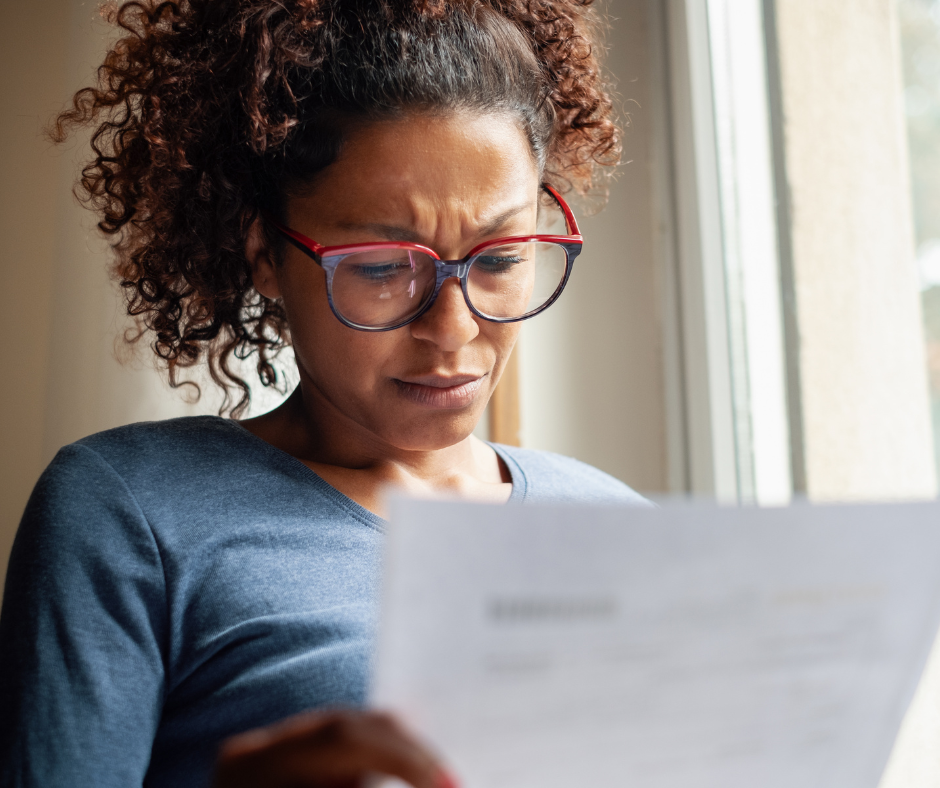 Woman looking at bills