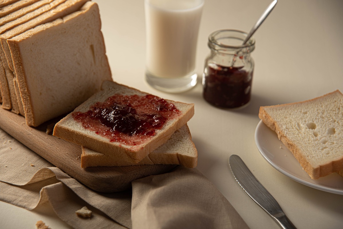 Slices of bread with pot of jam