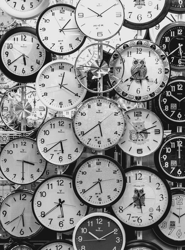 Black and white photo of clocks. 