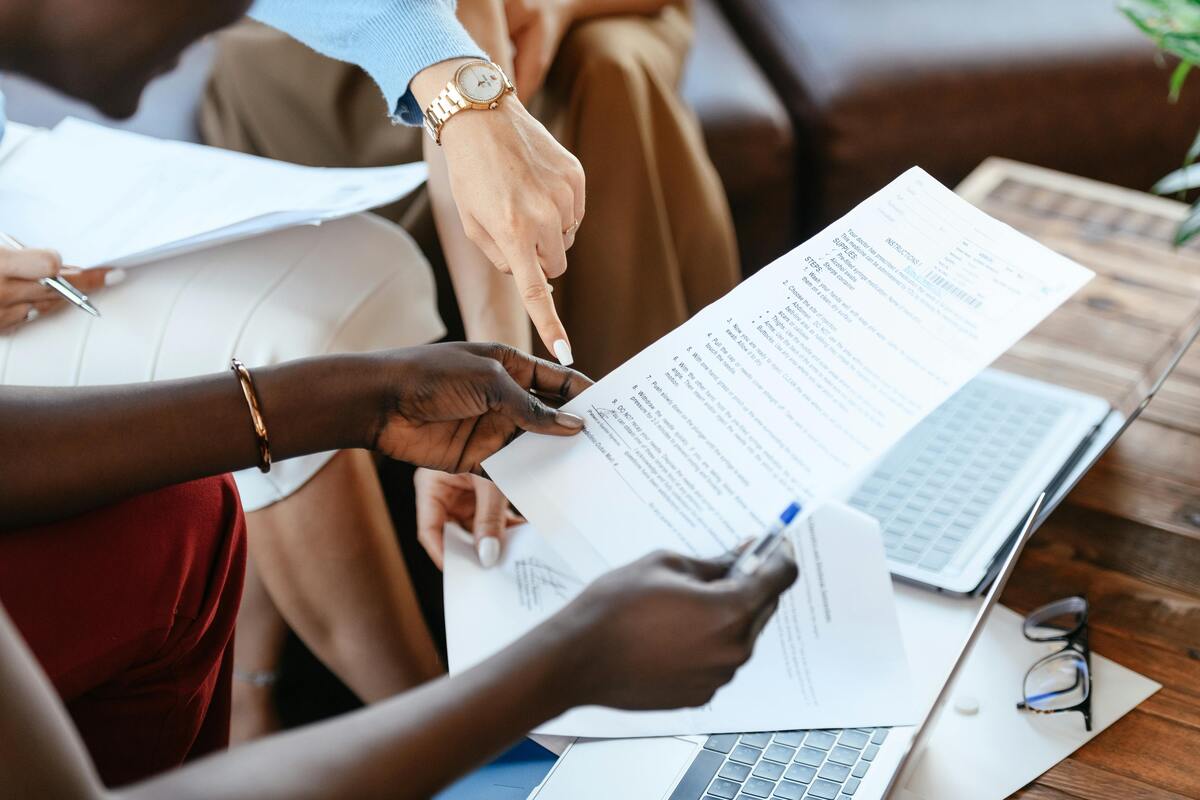 Businesswomen checking information in documents