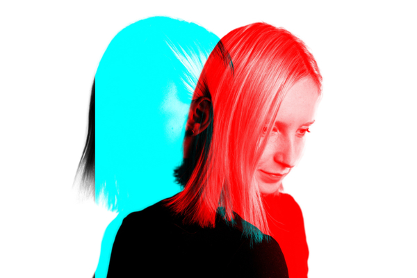 Double exposure portrait of a person in red and blue